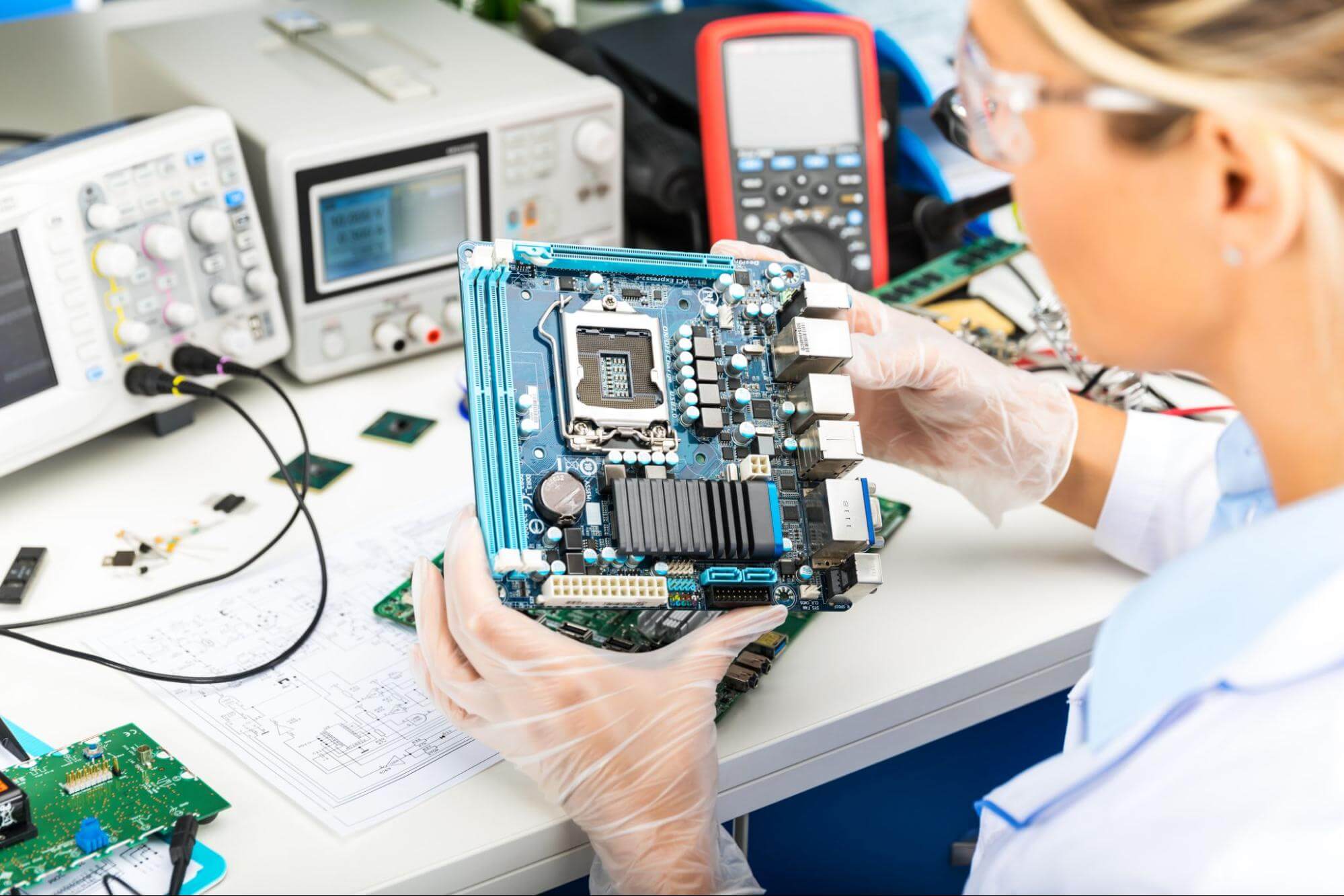 Woman Looking At Electronic Product Design And Manufacturing